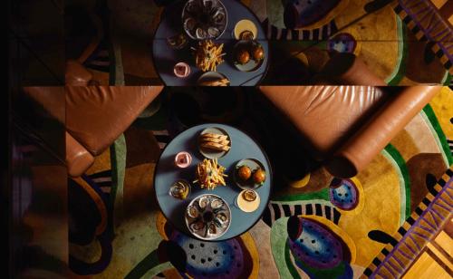 a table with a plate of donuts on it at Park Hyatt Melbourne in Melbourne