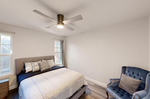 a bedroom with a bed and a ceiling fan at Denton Place Studio in Denton