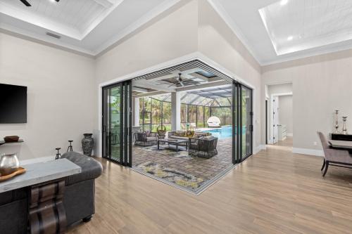 a living room with a couch and a table at Eden's Endless Escape in Naples