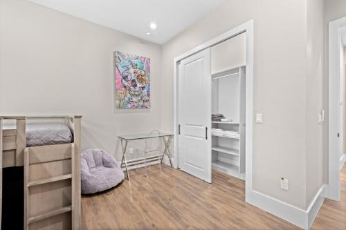 a bedroom with two bunk beds and a mirror at Eden's Endless Escape in Naples