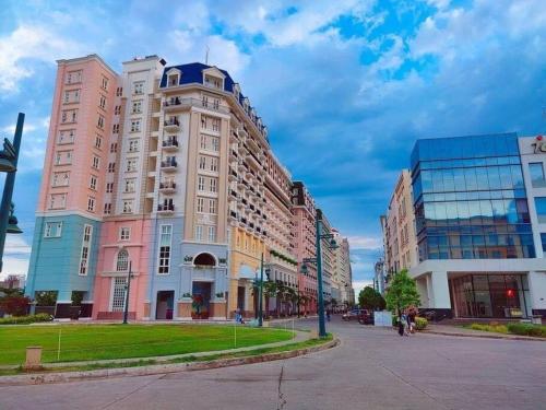 a large building on a street in a city at Saint Honore Executive: 6 guests, 5 beds, 2 bedrooms, 2 bathrms in Iloilo City