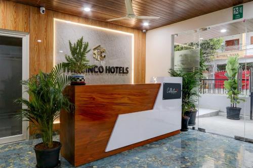 a lobby of a hotel with potted plants at Townhouse 1338 The Cinco Bliss in Hyderabad