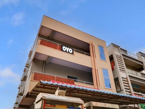 a apartment building with an oxo sign on it at Collection O Hotel SR Grand in Bībīnagar