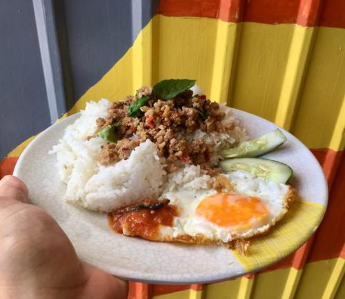a plate of food with rice and an egg at Alegreya Homestay + Cafe in General Luna