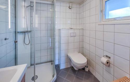 a bathroom with a toilet and a shower and a sink at Gorgeous Home In Jrpeland With House Sea View in Jørpeland