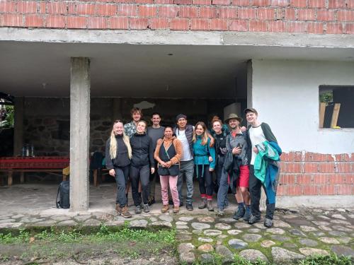 a group of people standing outside of a building at Lia B&B Lucmabamba in Sahuayacu