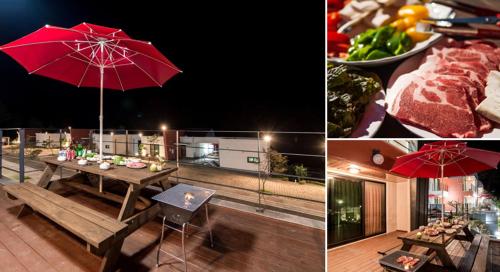 - une table de pique-nique avec un parasol rouge sur le balcon dans l'établissement Yoninsan Spring Resort, à Gapyeong