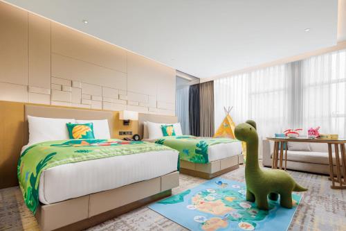 a bedroom with two beds and a toy dinosaur on a rug at Chengdu Marriott Hotel Financial Centre in Chengdu
