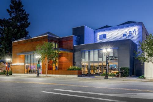 a building on a city street at night at Aloft Sunnyvale in Sunnyvale
