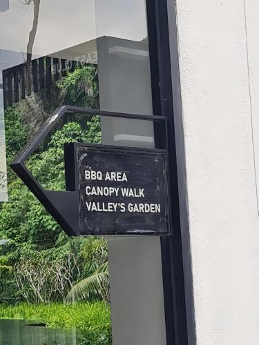 a sign on the side of a window of a building at The Cove Hillside Residence Ipoh in Ipoh