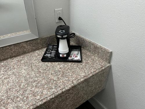 a coffeemaker sitting on top of a counter at Red Roof Inn Dunn in Dunn