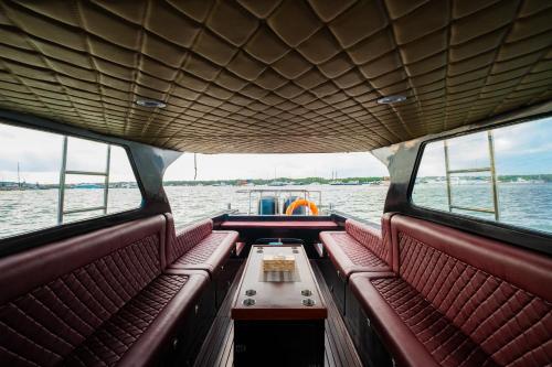 a boat with a table in the middle of the water at Queen Ruizi Private Yacht Charter in Pesanggaran