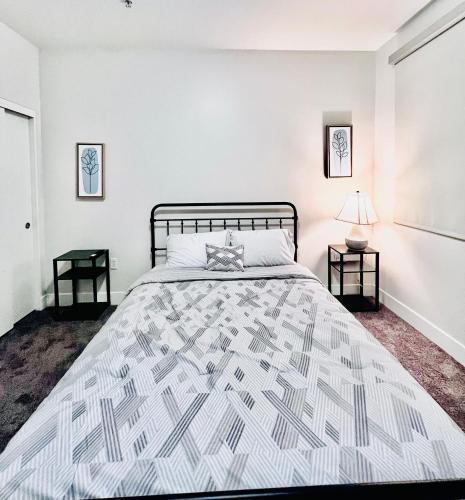 a bedroom with a large bed and two end tables at Stylish Hollywood Blvd. w/ FREE Parking in Los Angeles