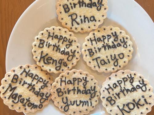a plate of cookies with happy birthday handwriting on them at Casa Allegra in Yamanakako
