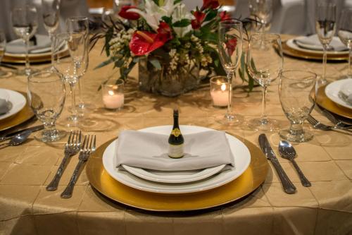a table with a plate with a bottle of wine on it at Four Points by Sheraton Bellingham Hotel & Conference Center in Bellingham