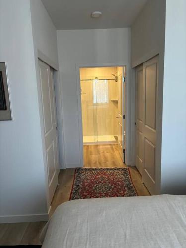 a bedroom with a bed and a walk in closet at Urban SLO Living- 1 mile from downtown in San Luis Obispo