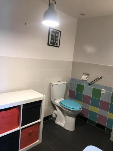a bathroom with a toilet and a sink at BelCiano (ancien Toit Vert) in Fitou