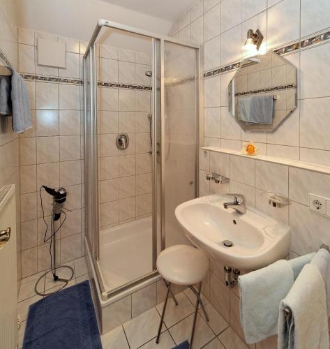 a bathroom with a shower and a sink at Landhaus Cornelia in Bad Birnbach