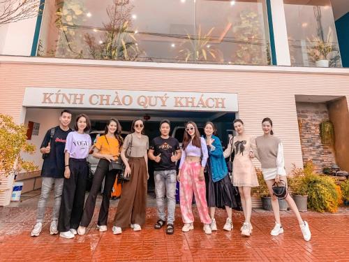 a group of people standing in front of a building at Khách Sạn Nhơn Lý LYS HOTEL in Quy Nhon