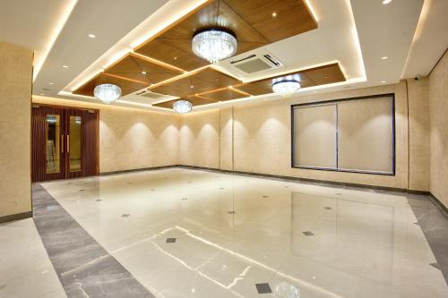 an empty room with a dance floor in a building at Lance 21 - Ashok Nagar in Chennai