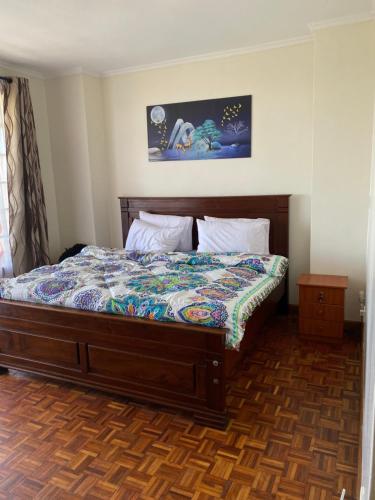 - une chambre avec un lit dans l'établissement Sigona Serene Valley, à Nairobi