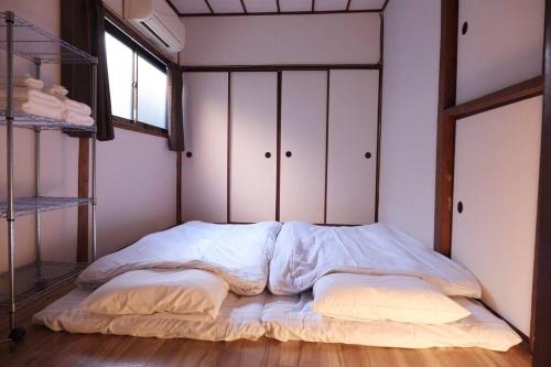 Krevet ili kreveti u jedinici u okviru objekta TSUBAME 101 staying private home