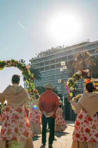 a group of people standing in front of a building at Le Meridien Nice in Nice