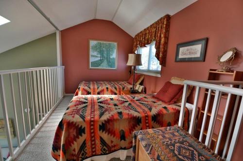 a bedroom with a bed and a balcony at Higher Altitude in Gatlinburg