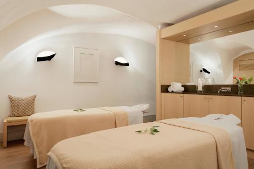 a room with two beds in a room at Augustine, a Luxury Collection Hotel, Prague in Prague