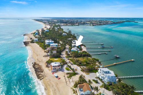 an aerial view of a beach with houses and the ocean at Aquarius North in Stuart