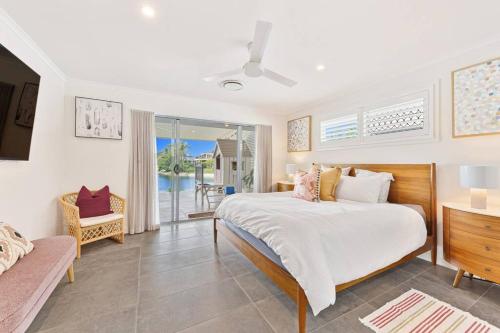 a bedroom with a bed and a view of the ocean at Broadbeach Waterfront home with pool in Gold Coast
