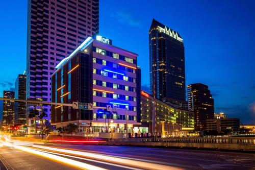 a city skyline with tall buildings at night at Aloft - Tampa Downtown in Tampa