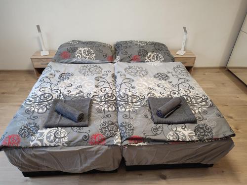 a bed with two pillows on it in a room at Ubytování U Venci in Valtice