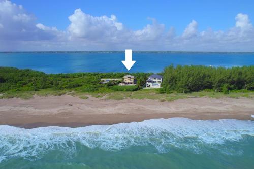 an aerial view of a house on an island in the ocean at Bella Vista in Fort Pierce