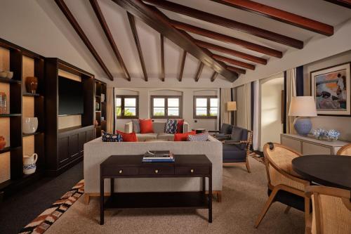 a living room with a couch and a table at Castillo Hotel Son Vida, a Luxury Collection Hotel, Mallorca in Palma de Mallorca
