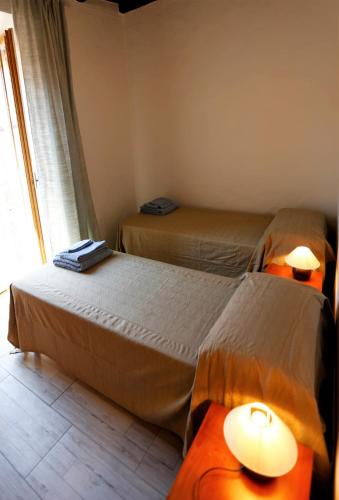 Cama o camas de una habitación en Casa Colonne Fiorite