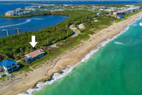an aerial view of a beach with a house at La Dolce Vita in Stuart