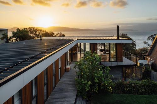 a house with a view of the ocean at Blessington Beachside Retreat -38km to CBD in South Arm