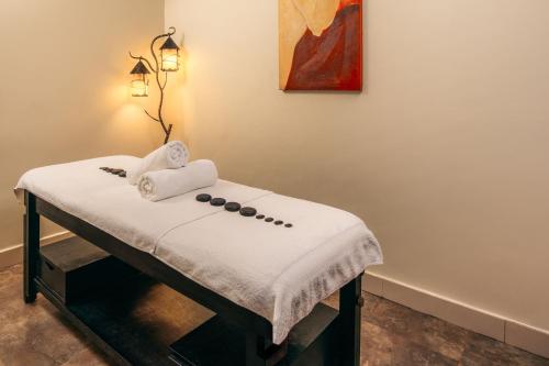 a table in a room with a towel at Delta Hotels by Marriott Dar es Salaam in Dar es Salaam