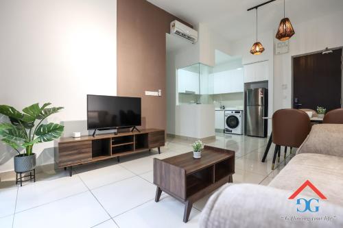 a living room with a flat screen tv and a couch at Astoria Ampang By Grabstay in Kuala Lumpur