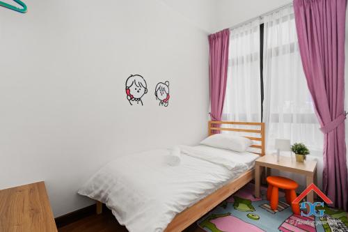 a small bedroom with a bed and a window at Astoria Ampang By Grabstay in Kuala Lumpur