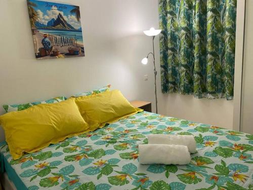 En eller flere senge i et værelse på N'JOK Papeete