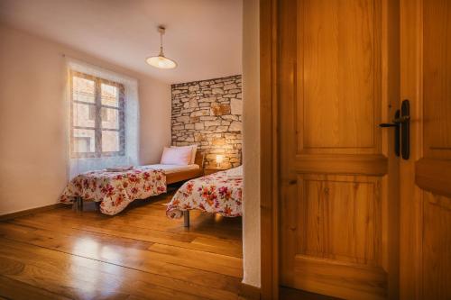 a room with two beds and a window at Casa ‘Crystal’ in Novigrad Istria