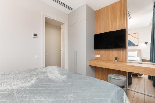 Μια τηλεόραση ή/και κέντρο ψυχαγωγίας στο Bellevue Residence Suites