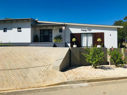 a house with a driveway in front of it at Happy Daze (Self catering) in Swellendam