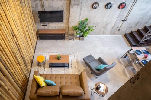 an overhead view of a living room with a couch and a table at ART LOFTS Valencia by Benisur in Valencia