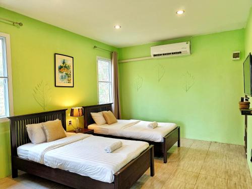 Katil atau katil-katil dalam bilik di Kong Garden Resort