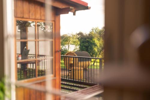 a view of a balcony with a table and chairs at OderPoint#Sauna#Jacuzzi in Gozdowice