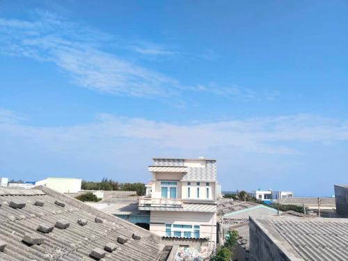a view of a building from the roofs of buildings at Homestay Hoàng Phúc in Cu Lao Thu