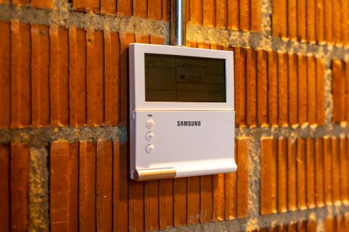 a samsung machine is attached to a wall at ART LOFTS Valencia by Benisur in Valencia